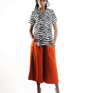 Shop Electric Print Strings Attached Shirt by NC Nairobi on Arrai. Discover stylish, affordable clothing, jewelry, handbags and unique handmade pieces from top Kenyan & African fashion brands prioritising sustainability and quality craftsmanship.