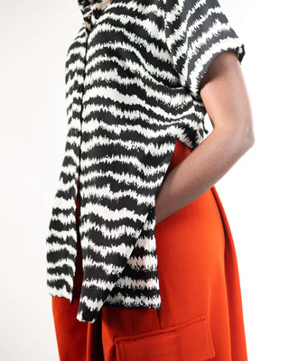 Shop Electric Print Strings Attached Shirt by NC Nairobi on Arrai. Discover stylish, affordable clothing, jewelry, handbags and unique handmade pieces from top Kenyan & African fashion brands prioritising sustainability and quality craftsmanship.
