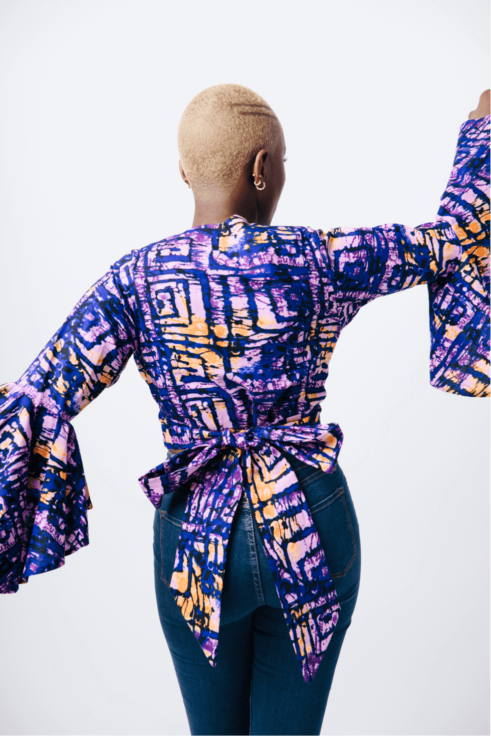 Shop Bell Sleeve Wrap Crop Top by Cyami Custom Fit on Arrai. Discover stylish, affordable clothing, jewelry, handbags and unique handmade pieces from top Kenyan & African fashion brands prioritising sustainability and quality craftsmanship.