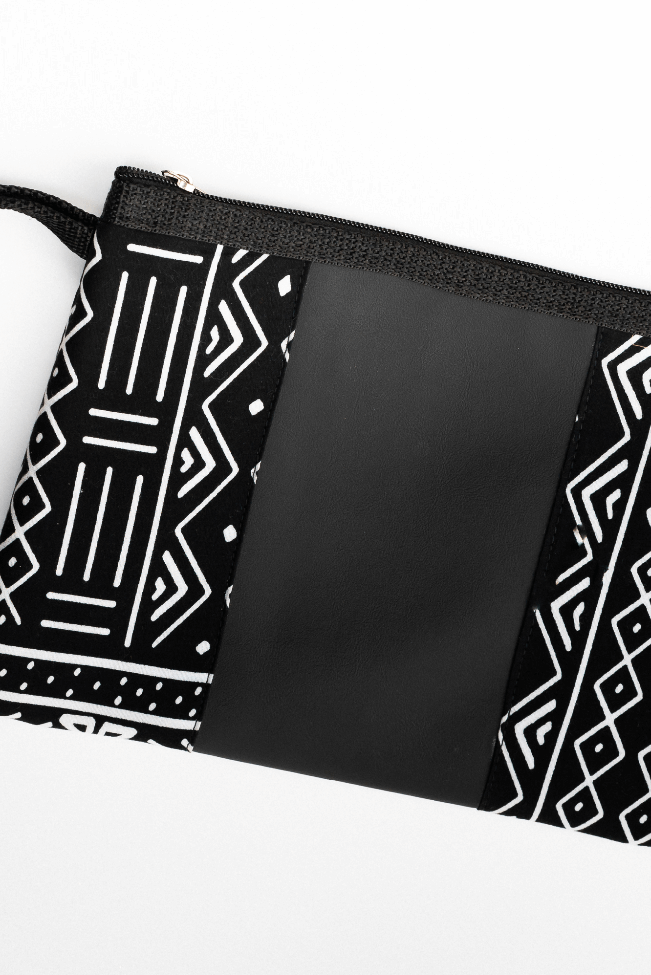 Shop Black and White Clutch Bag by ELISKIS on Arrai. Discover stylish, affordable clothing, jewelry, handbags and unique handmade pieces from top Kenyan & African fashion brands prioritising sustainability and quality craftsmanship.