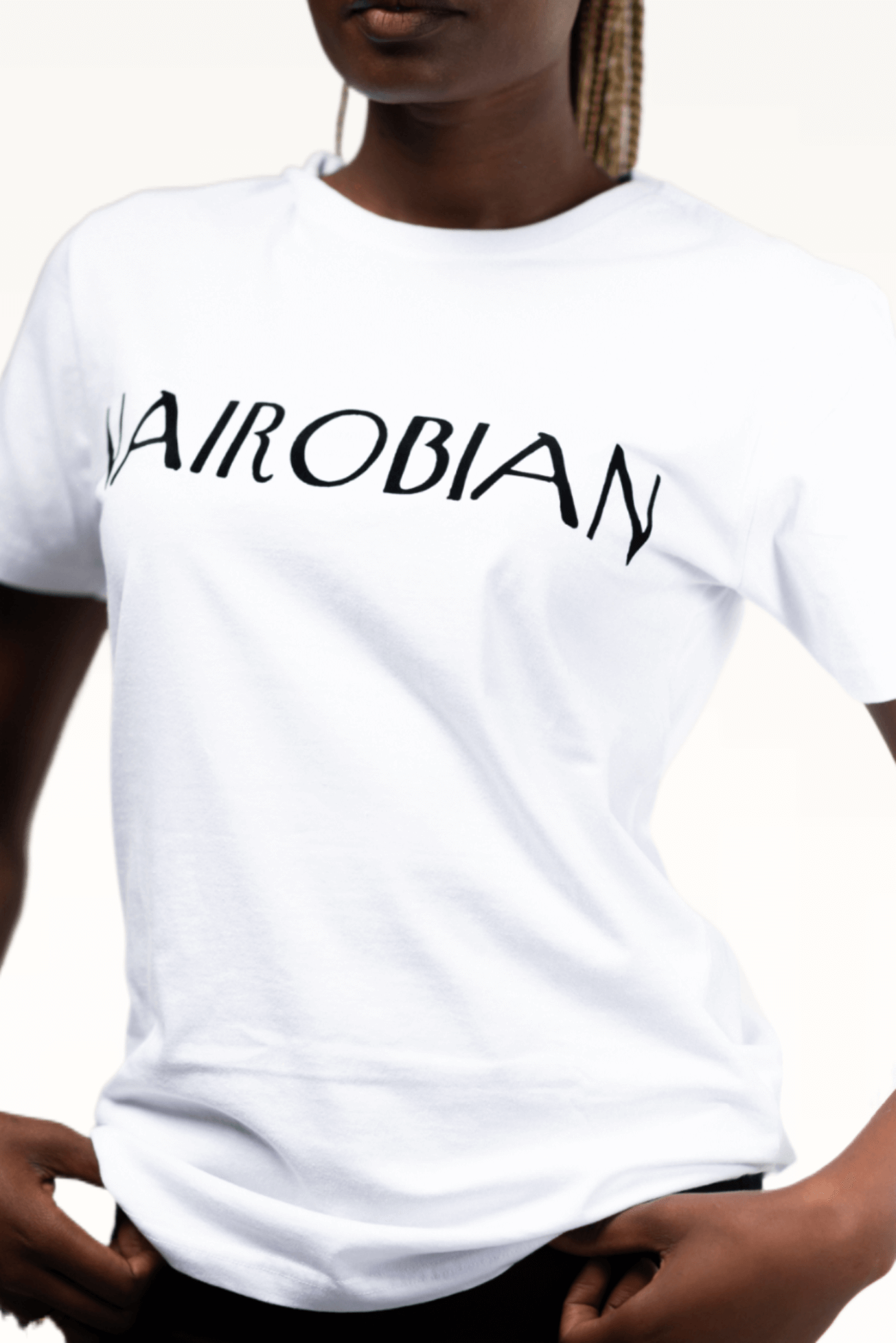 Shop Nairobian Plain T-Shirt (Black Text Print) by Kali Works on Arrai. Discover stylish, affordable clothing, jewelry, handbags and unique handmade pieces from top Kenyan & African fashion brands prioritising sustainability and quality craftsmanship.
