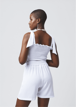 Shop Ribbed Tie Sleeveless Top by Cyami Custom Fit on Arrai. Discover stylish, affordable clothing, jewelry, handbags and unique handmade pieces from top Kenyan & African fashion brands prioritising sustainability and quality craftsmanship.