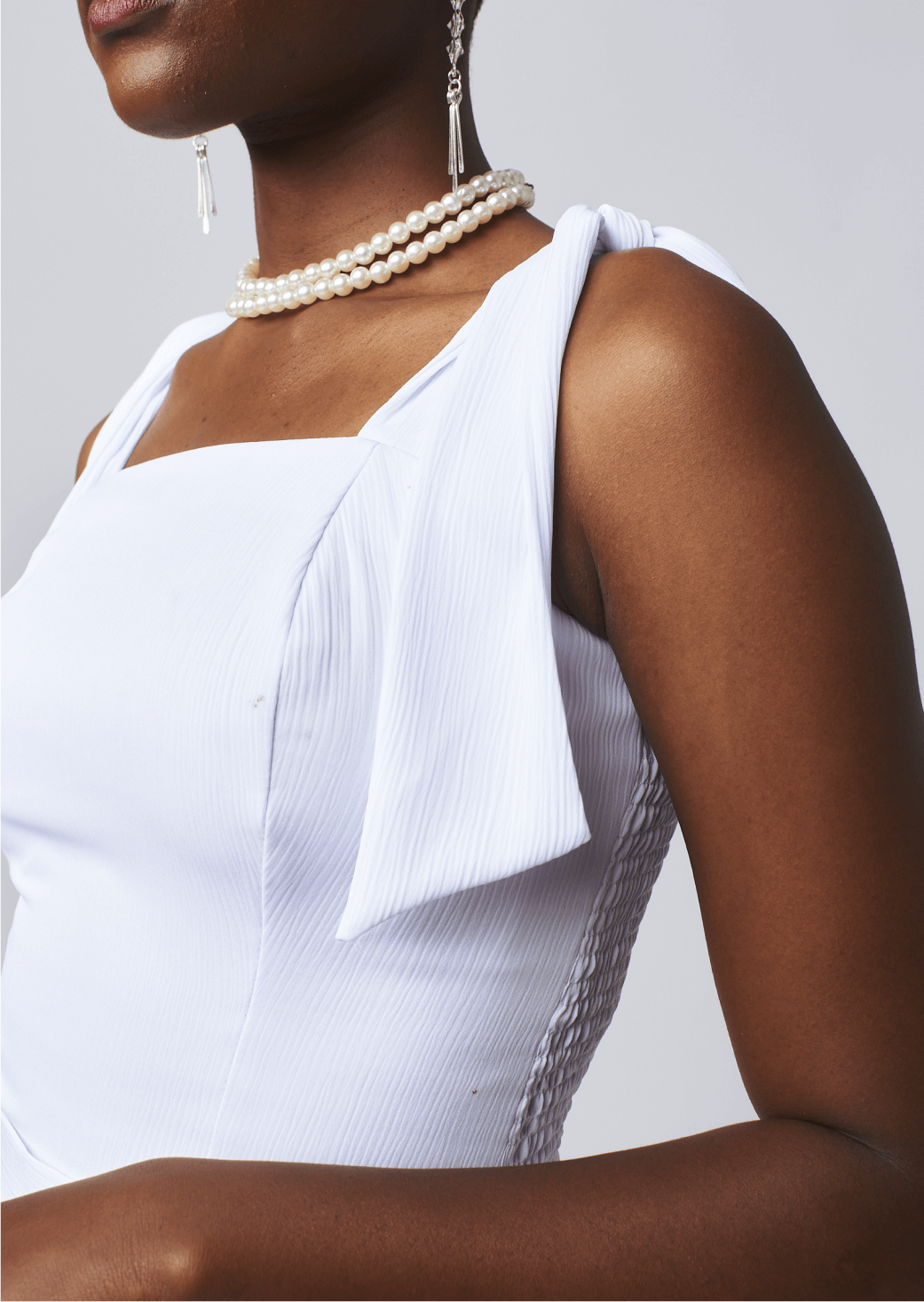 Shop Ribbed Tie Sleeveless Top by Cyami Custom Fit on Arrai. Discover stylish, affordable clothing, jewelry, handbags and unique handmade pieces from top Kenyan & African fashion brands prioritising sustainability and quality craftsmanship.