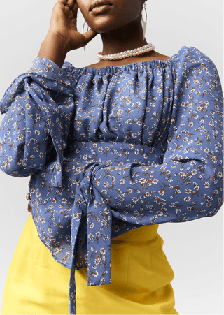 Shop Dalia Floral Bell Sleeve Top by Cyami Custom Fit on Arrai. Discover stylish, affordable clothing, jewelry, handbags and unique handmade pieces from top Kenyan & African fashion brands prioritising sustainability and quality craftsmanship.