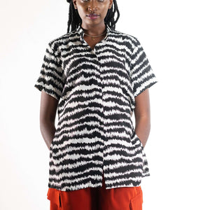 Shop Electric Print Strings Attached Shirt by NC Nairobi on Arrai. Discover stylish, affordable clothing, jewelry, handbags and unique handmade pieces from top Kenyan & African fashion brands prioritising sustainability and quality craftsmanship.