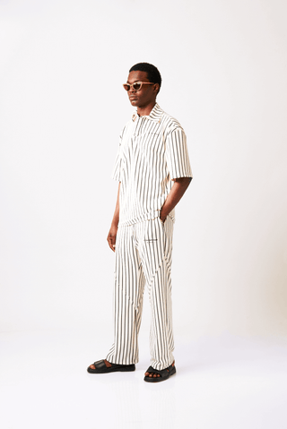 Shop Bahari Polo Striped Shirt by Metamorphisized on Arrai. Discover stylish, affordable clothing, jewelry, handbags and unique handmade pieces from top Kenyan & African fashion brands prioritising sustainability and quality craftsmanship.
