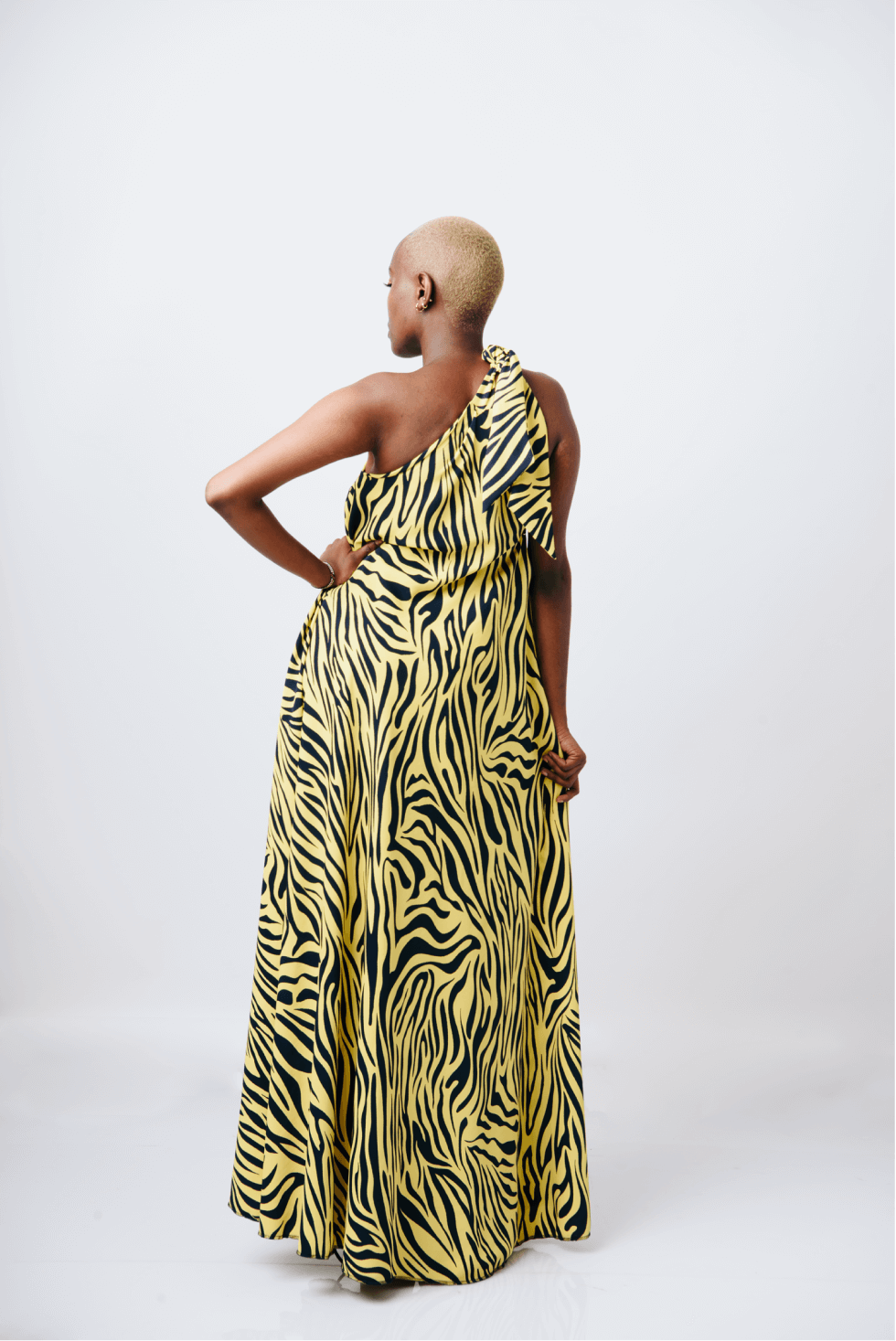 Shop Mara Tie One-Shoulder Maxi Dress by Cyami Custom Fit on Arrai. Discover stylish, affordable clothing, jewelry, handbags and unique handmade pieces from top Kenyan & African fashion brands prioritising sustainability and quality craftsmanship.