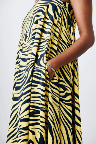 Shop Mara Tie One-Shoulder Maxi Dress by Cyami Custom Fit on Arrai. Discover stylish, affordable clothing, jewelry, handbags and unique handmade pieces from top Kenyan & African fashion brands prioritising sustainability and quality craftsmanship.
