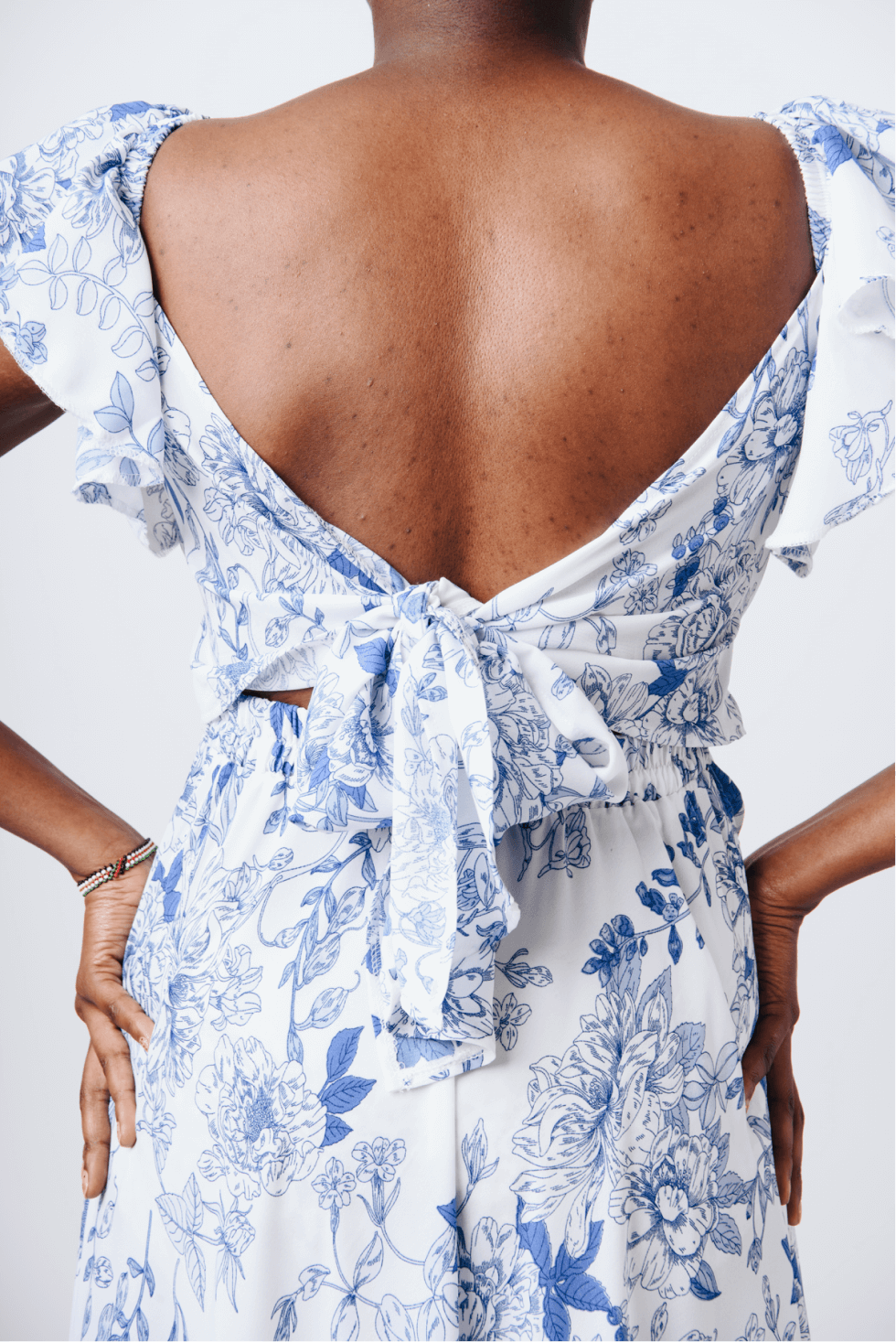 Shop Bahari White & Blue Floral Maxi Dress by Cyami Custom Fit on Arrai. Discover stylish, affordable clothing, jewelry, handbags and unique handmade pieces from top Kenyan & African fashion brands prioritising sustainability and quality craftsmanship.