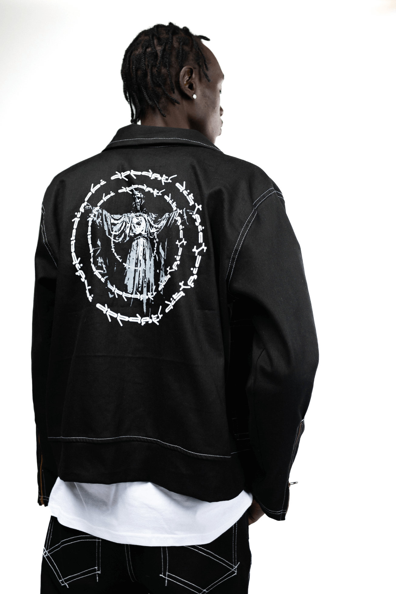 Black denim jacket with top design on the back